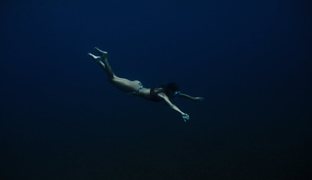 Woman freediving in the sea in St Lucia