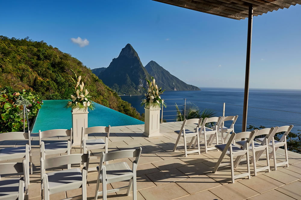 Chairs and flower pedestals on the terrace at Cosmos St Lucia, ready for a Wedding Cermony