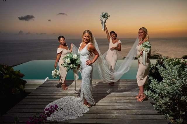 A bride with her bridesmaids at Cosmos St lucia, with a setting sun behind them